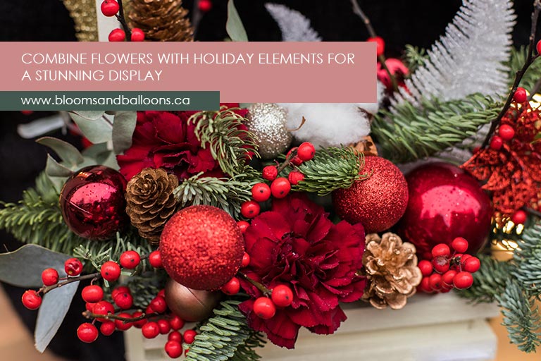Combine flowers with holiday elements for a stunning display